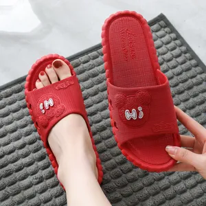 Red non-slip home slippers with cute bear design, soft wave sole for bathroom indoor wear.