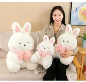 Cute bread rabbit plush toy detail view showing soft stuffed animal doll with a sweet pink bow.