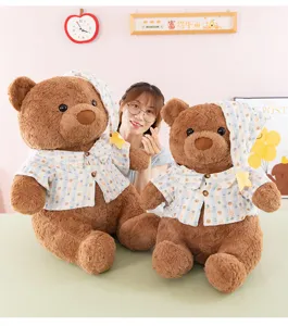 Cute teddy bear plush toy with blue striped shirt and nightcap, soft stuffed doll gift.
