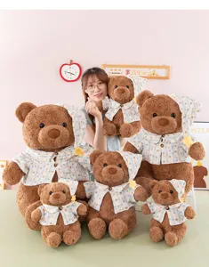 Cute plush teddy bear doll wearing a stylish plaid shirt and matching nightcap for gift.