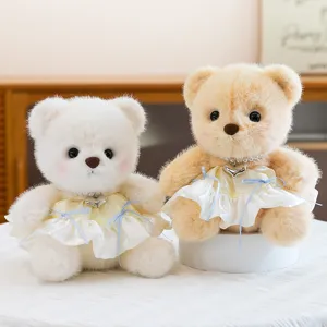 Cute plush teddy bear toy with princess dress and heart pendant, ideal girl birthday gift and decor.