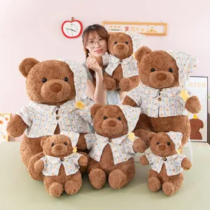 Cute plush teddy bear stuffed animal wearing cute pajamas and sleeping cap, soft toy gift for kids.