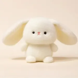 Cute white long-eared plush bunny toy, soft stuffed animal doll for desk decor and gifts.