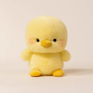 Cute yellow duck plush toy detail view, soft stuffed animal doll for desk companion.
