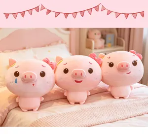 Cute pink plush pig doll detail view featuring soft fabric and sweet bow decoration.