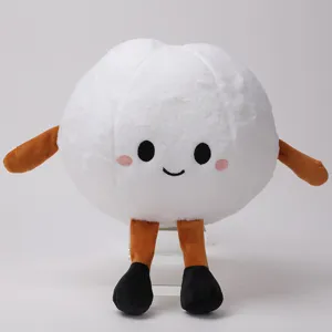 Detalle de peluche redondo blanco suave con extremidades marrones y cara bordada linda.