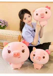 Cute pink pig plush toy detail view, soft stuffed doll with bow for girl birthday gift
