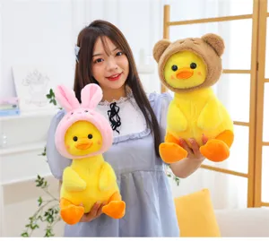 Cute yellow duck plush toy wearing animal hat, super soft stuffed doll, ideal gift for kids.