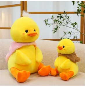 Cute yellow duck plush toys in detail view, featuring soft stuffed fabric and cozy design.