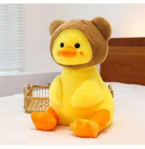 Cute plush yellow duck toy with brown bear ear hat, super soft stuffed doll for room decor.