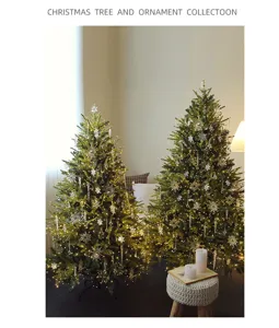 Detailed view of two Christmas trees with crystal ornaments and warm fairy lights