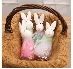 Set of 4 Easter bunny fabric dolls with lace flower dresses in a rustic woven basket