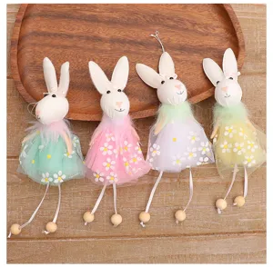 Detail of fabric Easter rabbits with daisy tulle dresses and bead legs.