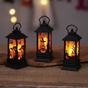 Three Halloween LED wind lanterns with pumpkin and witch silhouettes for spooky decor.