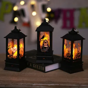 Spooky Halloween decorative lanterns with glowing LED candles and haunted house graphics.