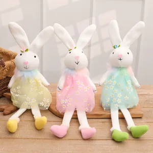 Three adorable Easter bunny plush dolls in floral dresses for holiday gifts and decor