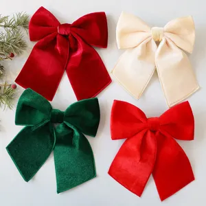 Set of large velvet Christmas bows in red, green, and cream for tree decoration