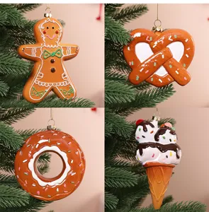 Assorted Christmas ornaments including gingerbread man, donut, and ice cream shapes