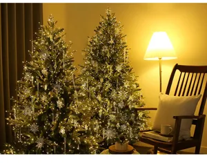 Cozy home Christmas scene featuring large trees with warm glowing crystal ornaments