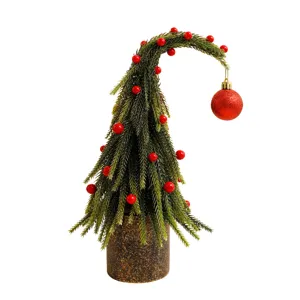 Decorative bent mini Christmas tree tabletop ornament with red berries and glittery bauble
