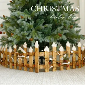 Clôture de sapin de Noël en bois rustique avec neige et pommes de pin