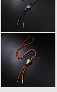 Detailansicht von Vintage-Punk-Bolo-Krawatten mit gravierten Legierungsanhängern in Schwarz.