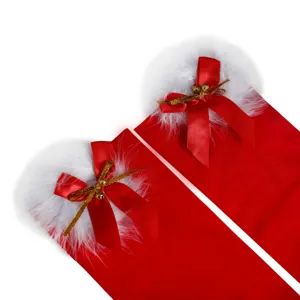 Calze lunghe natalizie rosse spesse con bordo in pelliccia sintetica e fiocco per le feste.