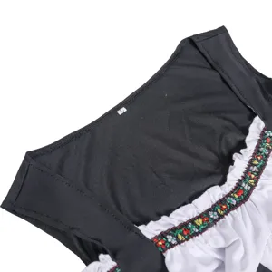 Close-up detail of German Oktoberfest beer maid costume collar with traditional floral trim.