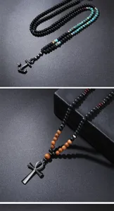 Close-up of men's volcanic stone necklaces with vintage anchor and Ankh cross pendants