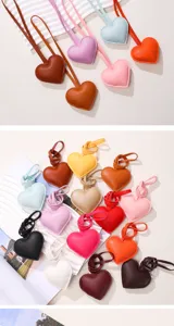 Various colorful heart-shaped PU leather charms shown in multiple vibrant shades and textures