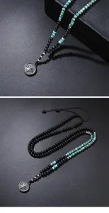 Close-up of men's lava rock and turquoise bead necklace with a vintage compass pendant