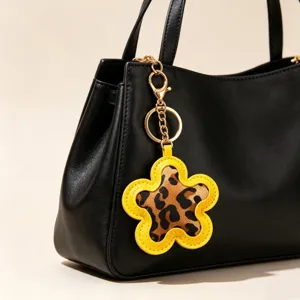 Stylish leopard print flower PU leather keychain charm for ladies handbags accessories.