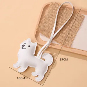 Pendentif mignon chien Samoyède en cuir PU pour sacs à main avec une sangle de 25cm