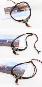 Close-up of retro ethnic braided rope necklace with tooth pendant and beads