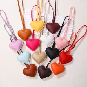 Colorful heart-shaped PU leather bag charms and keychains in a variety of vibrant colors