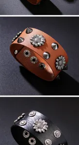Detailed macro shot of vintage punk leather bracelets featuring metal rivets and flower studs.