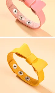 Vue détaillée de bracelets nœuds en cuir PU rose et jaune avec boutons-pression réglables