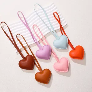 Handmade PU leather heart keychain pendants in various pastel colors for bags