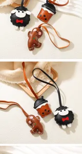 Close-up view of cute PU leather bag charms including gingerbread man, milk tea cup, and sheep