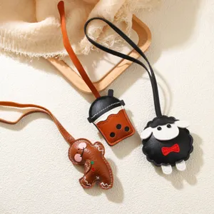 Cute PU leather cartoon bag charms featuring gingerbread man, boba cup, and sheep shapes.