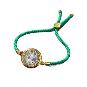 Adjustable green braided rope bracelet with vintage gold coin pendant