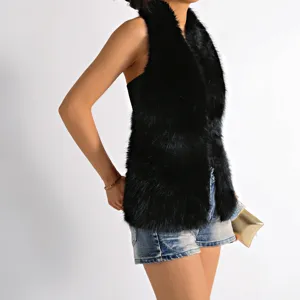 Detailed view of black Mongolian fur halter top showing plush texture and backless design