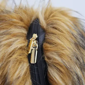 Close-up detail of a faux fur backpack featuring a stylish gold double zipper design.