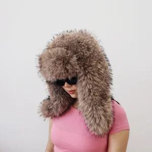 Detailed shot of an oversized faux raccoon fur ushanka hat for Y2K spicy girl style