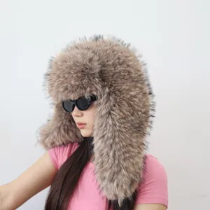 Detailed side view of a fluffy brown faux fur trapper hat worn by a fashion model