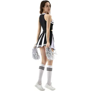 Detailed view of the black and white cheerleading crop top and pleated skirt outfit with pom poms.