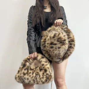Detailed view of leopard print faux fur bucket hat and hobo bag set with chain strap