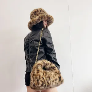 Detailed view of leopard print faux fox fur bucket hat and matching hobo chain bag