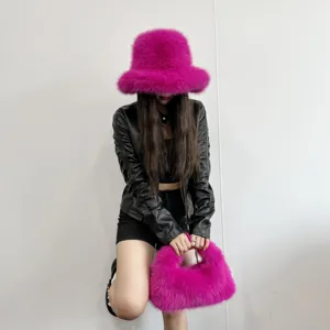 Vibrant pink faux fur bucket hat and matching hobo handbag set shown in detail view.