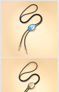 Detailed view of Western cowboy bolo ties with rabbit and frog illustrated pendants.